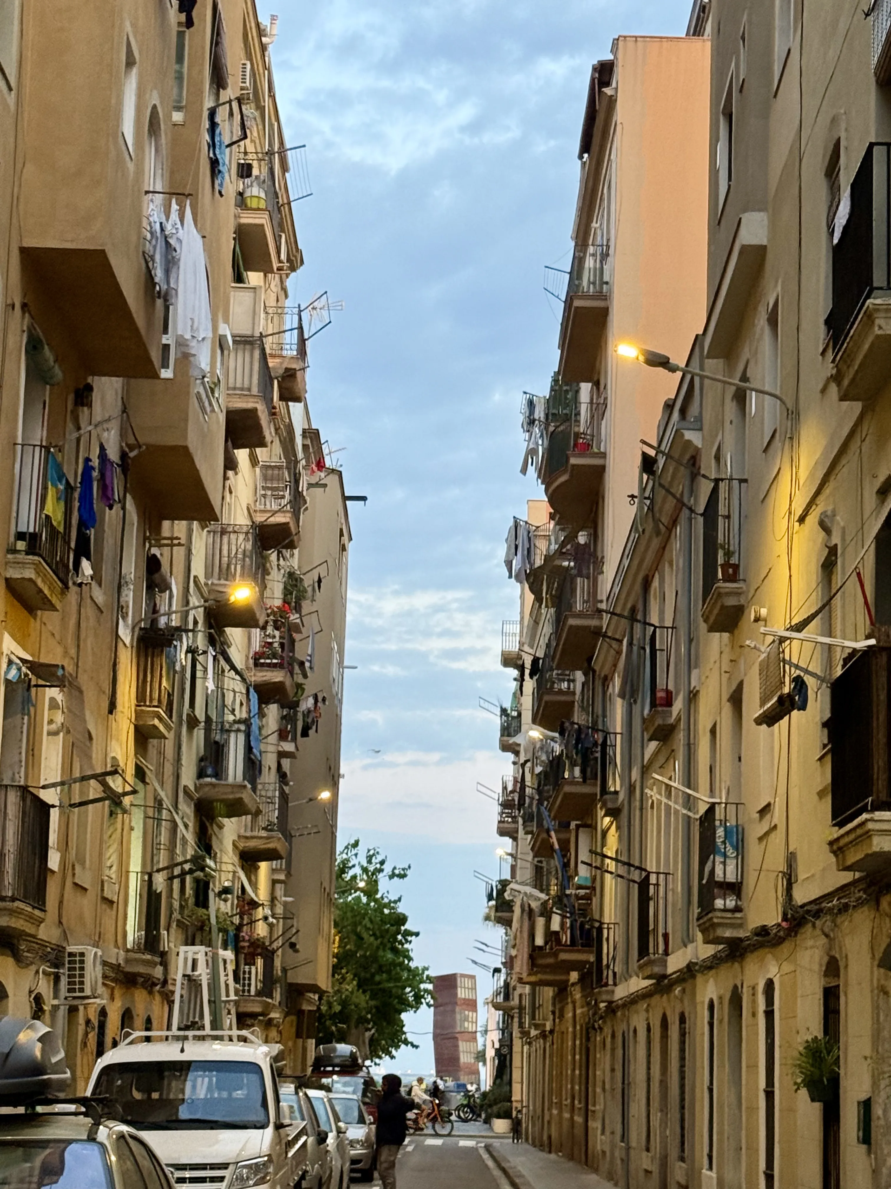 Narrow residential street with traditional balconies in Barceloneta's old fishing quarter, Barcelona