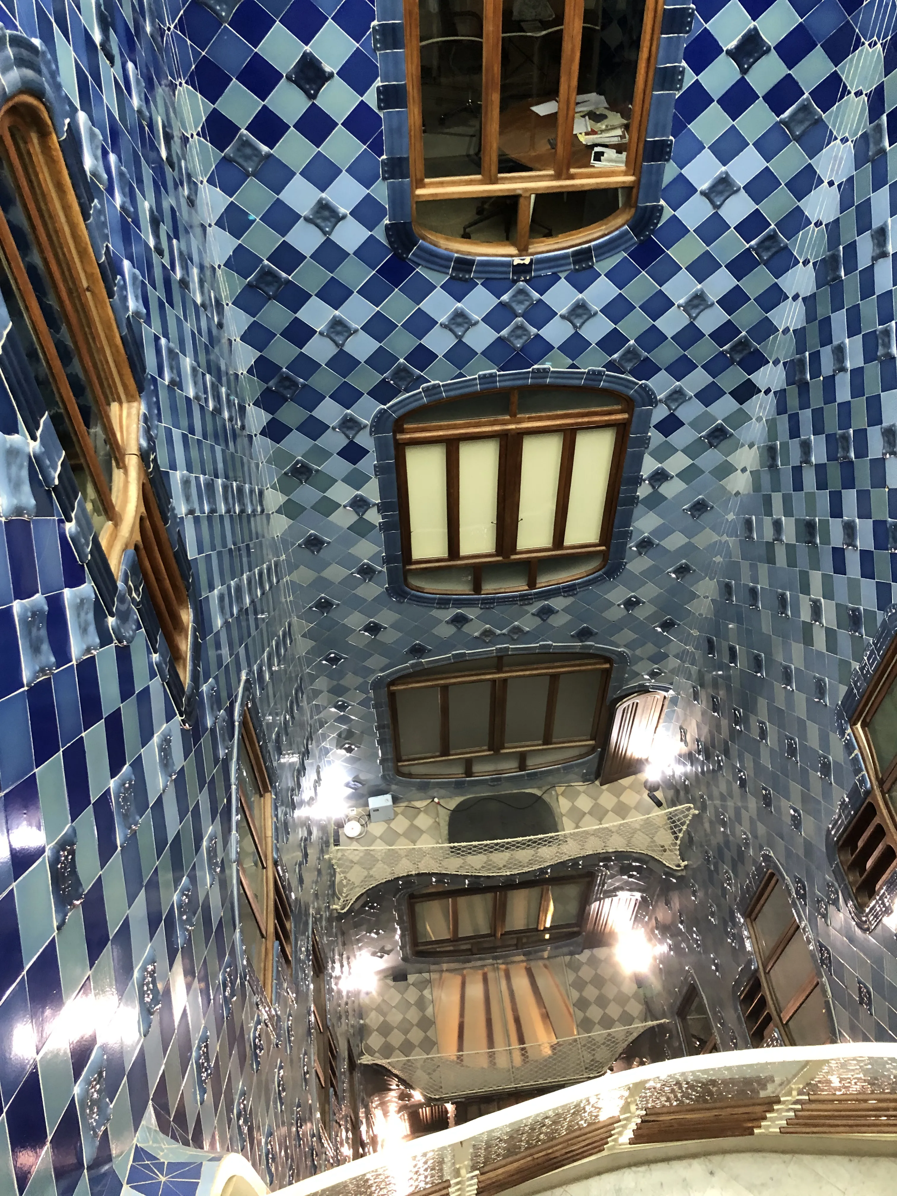 Casa Batlló staircase blue tiles viewed from the top looking down