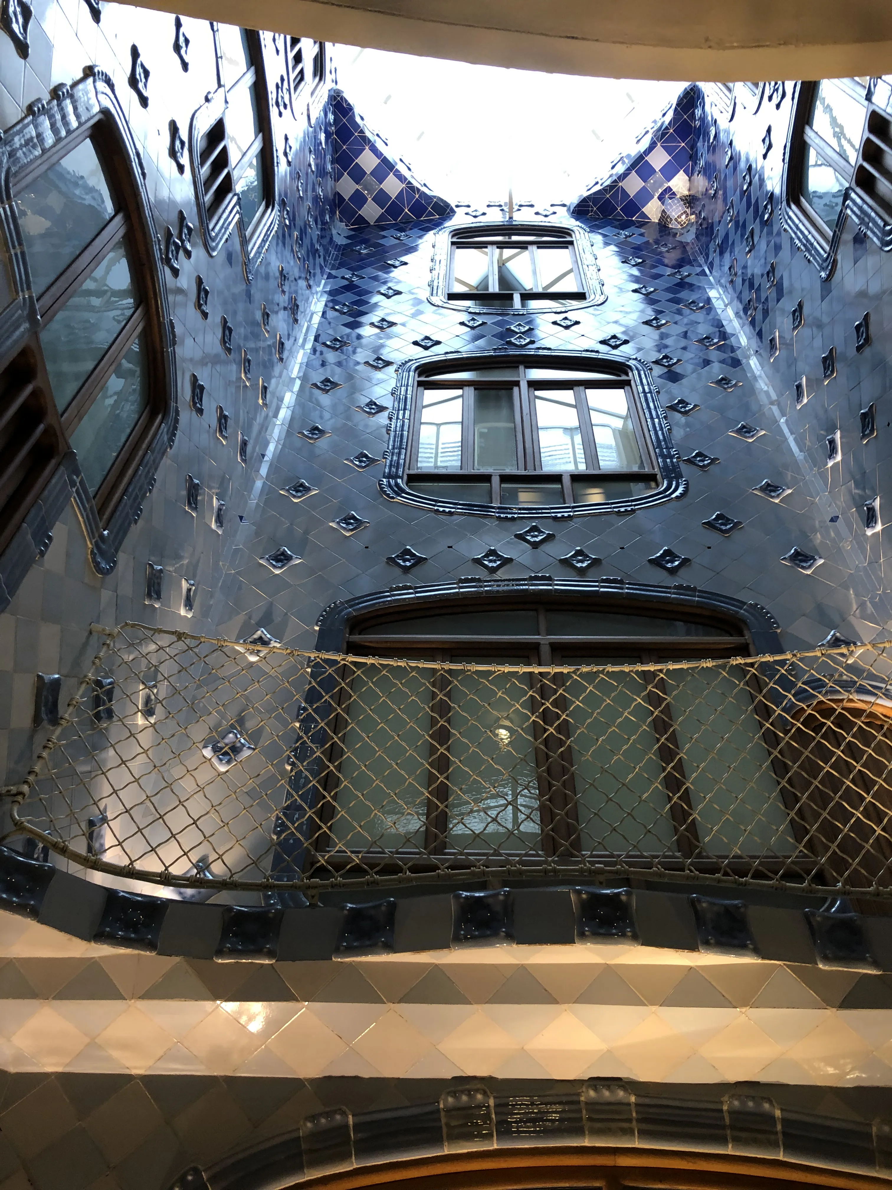 Casa Batlló staircase blue tiles viewed from ground level