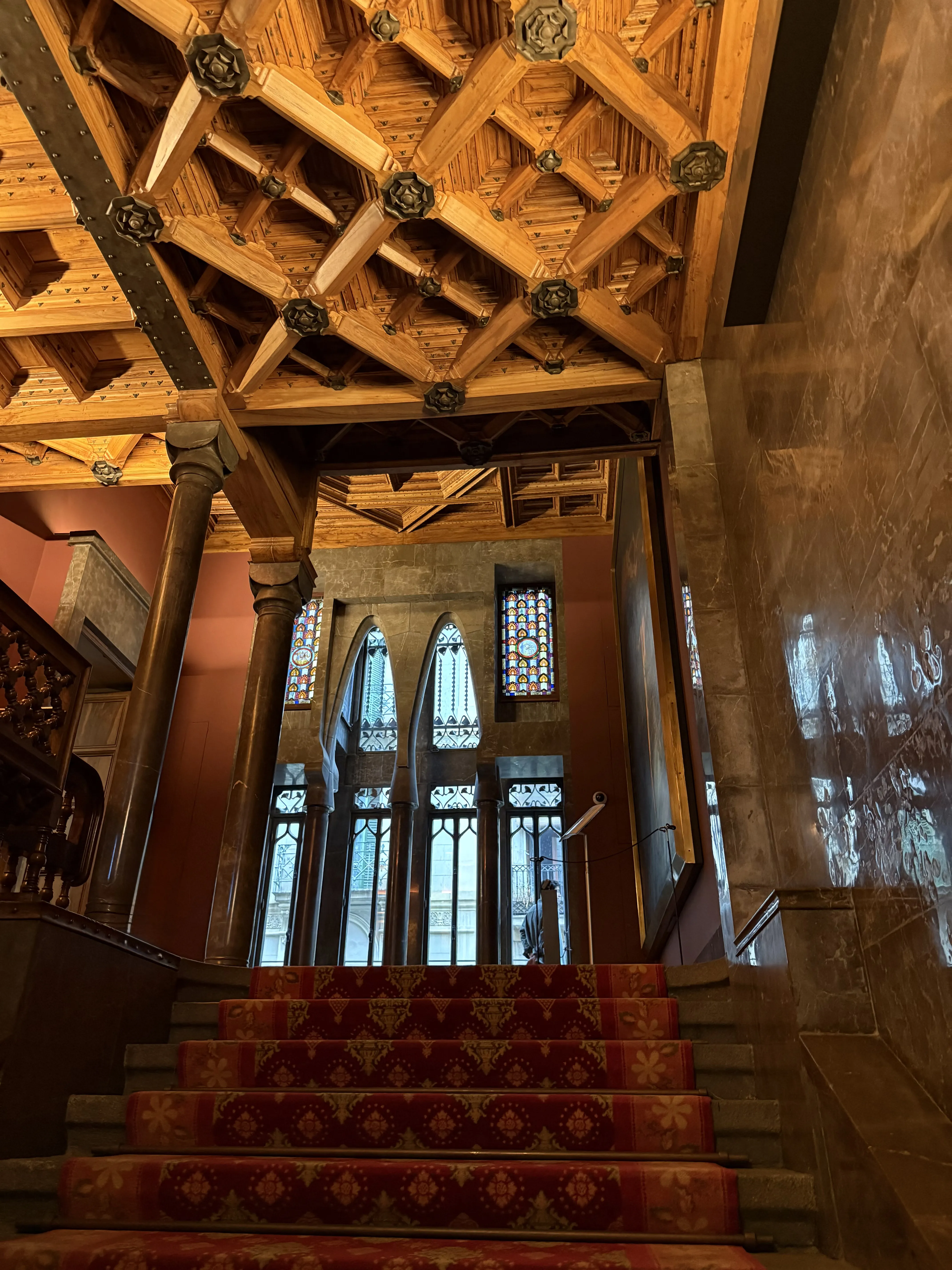 Wooden staircase leading to the upper floor of Palau Güell, Barcelona